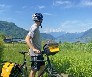 Cyclist looks at the lake Ossiach in Carinthia
