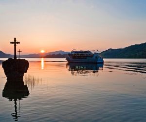 Sunset and ship at Mondsee Lake